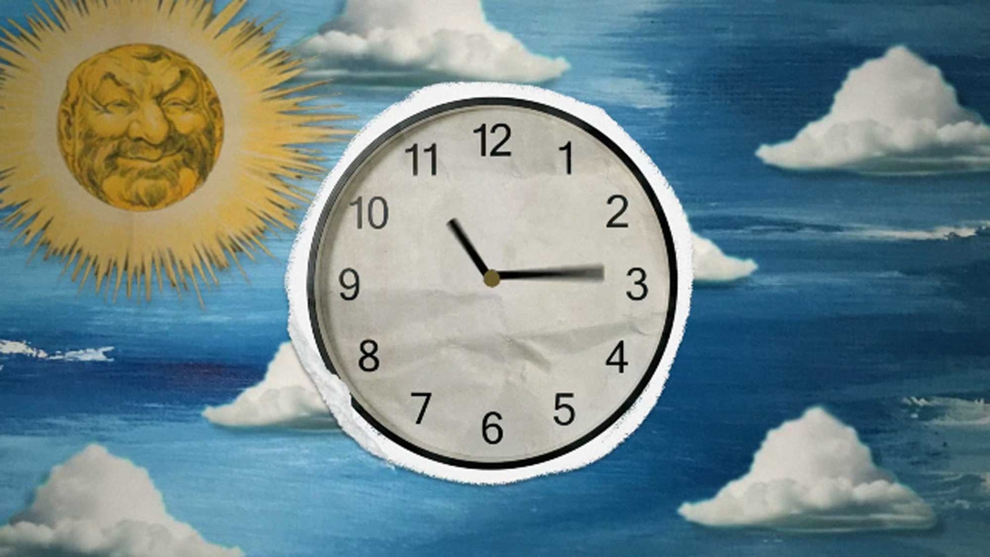 A clock in the foreground 
		with a blue sky, clouds and a sun in the background