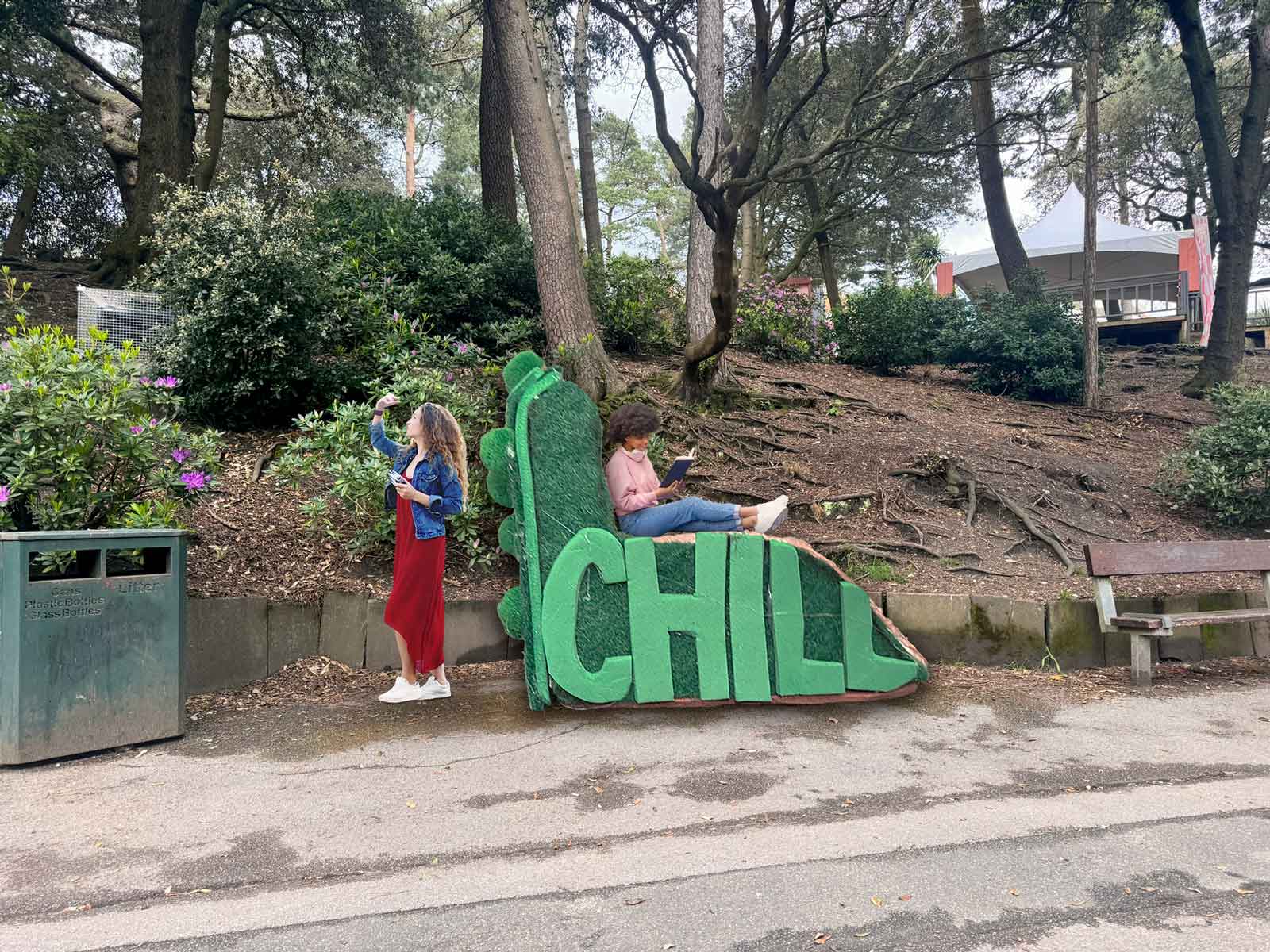 A seating structure with the word 
		Chill along the side and moss growing on it